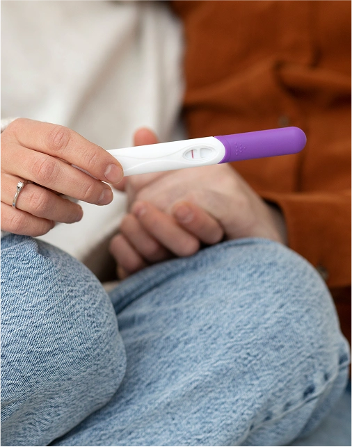 Close up couple with pregnancy test 
