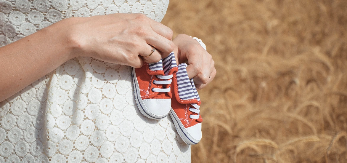 Lady with baby shoe img 2 Lady with baby shoe img 2