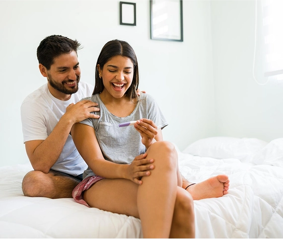 Couple enjoying pregnancy test