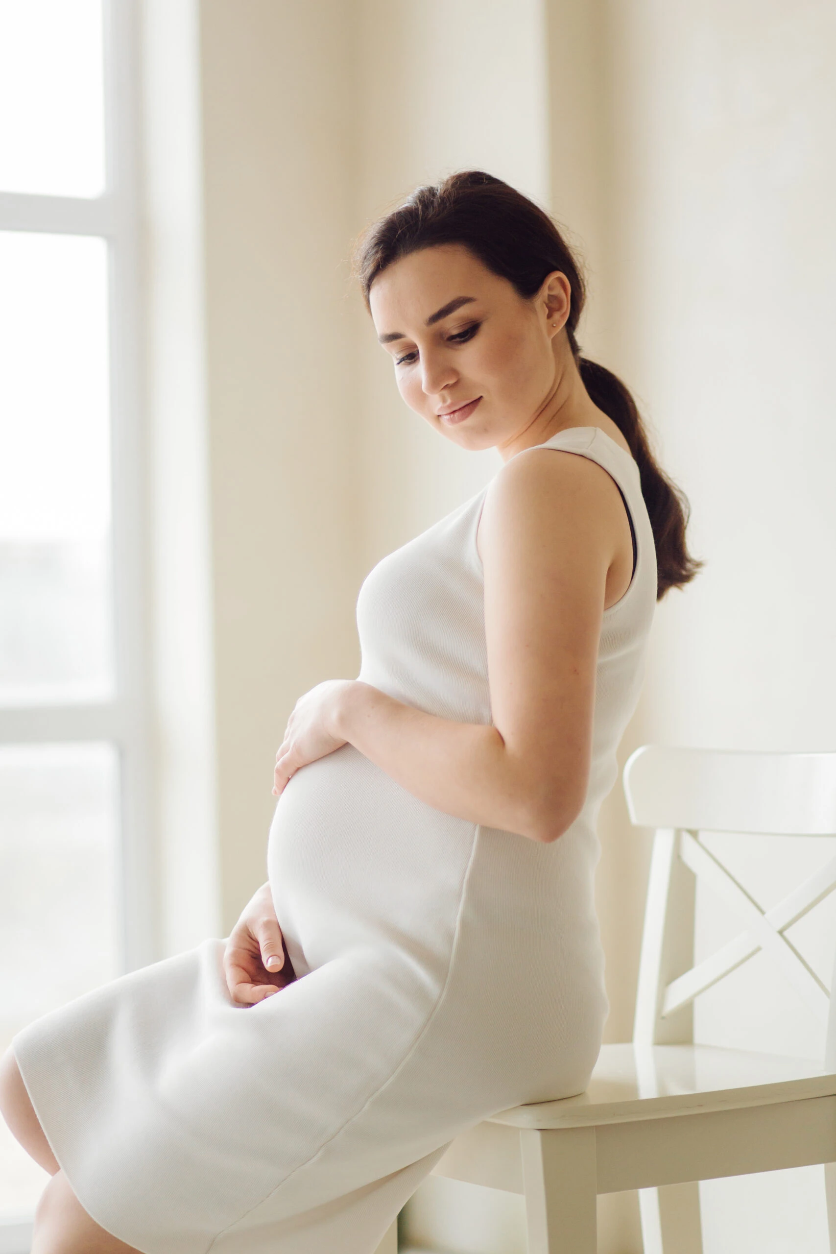 beautiful-young-pregnant woman posing studio dress scaled