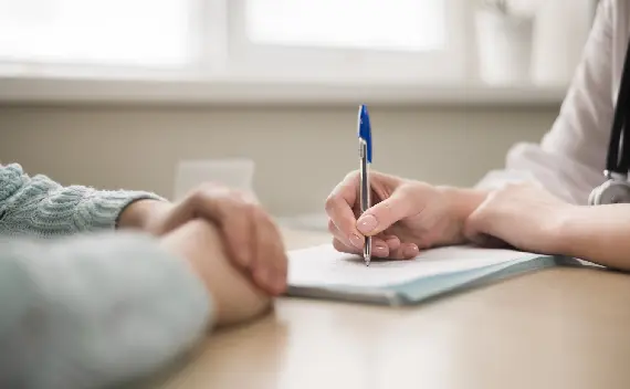 close up doctor writing prescription