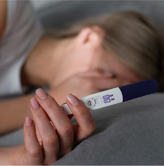woman pregnancy test in distress